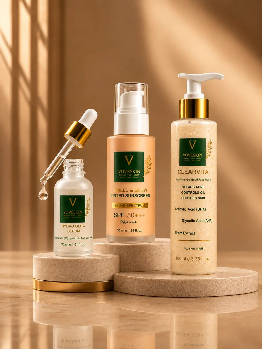 Three products (Serum, sunblock and a facewash) are placed on a marble.